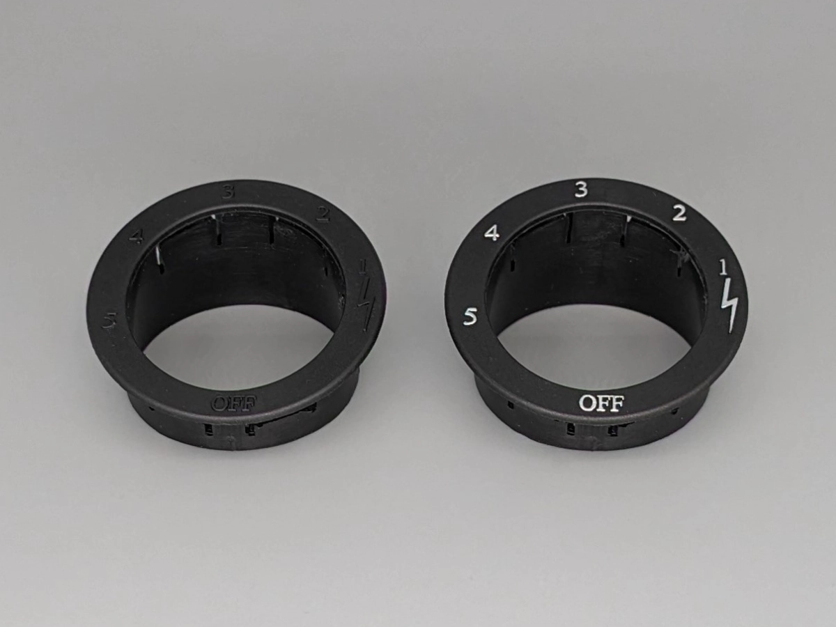 Hot foil printed bezels and trim parts